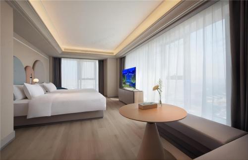 Imagen de la habitación del Hotel Mercure Suzhou Shilu Shantang. Foto 7