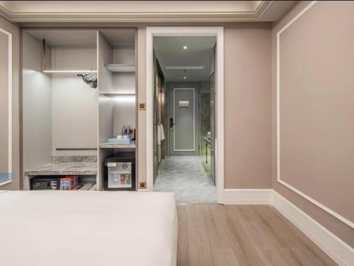 Imagen de la habitación del Hotel Mercure Wuxi Taihu Scenic Area Jiangnan University. Foto 5