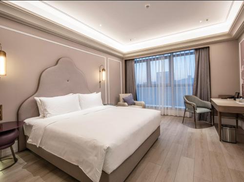 Imagen de la habitación del Hotel Mercure Wuxi Taihu Scenic Area Jiangnan University. Foto 6