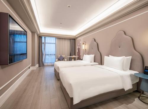 Imagen de la habitación del Hotel Mercure Wuxi Taihu Scenic Area Jiangnan University. Foto 9