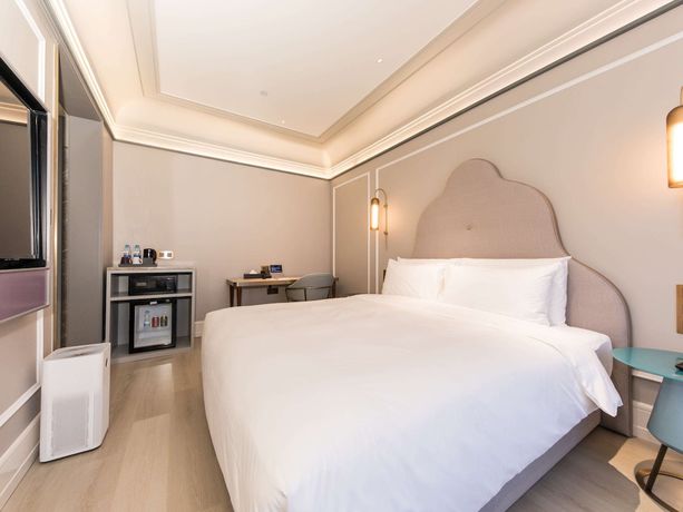 Imagen de la habitación del Hotel Mercure Xian Dayan Pagoda. Foto 11