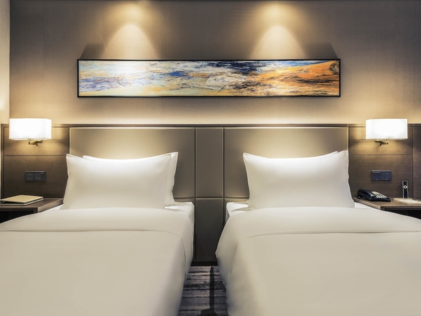 Imagen de la habitación del Hotel Mercure Yantai Golden Beach. Foto 14