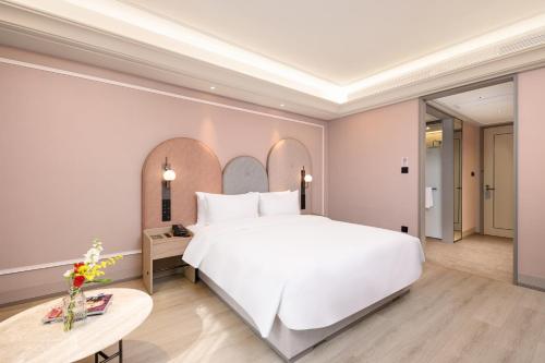 Imagen de la habitación del Hotel Mercure Yixing Wanda Plaza. Foto 18