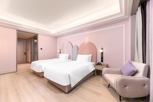 Imagen de la habitación del Hotel Mercure Yixing Wanda Plaza. Foto 19