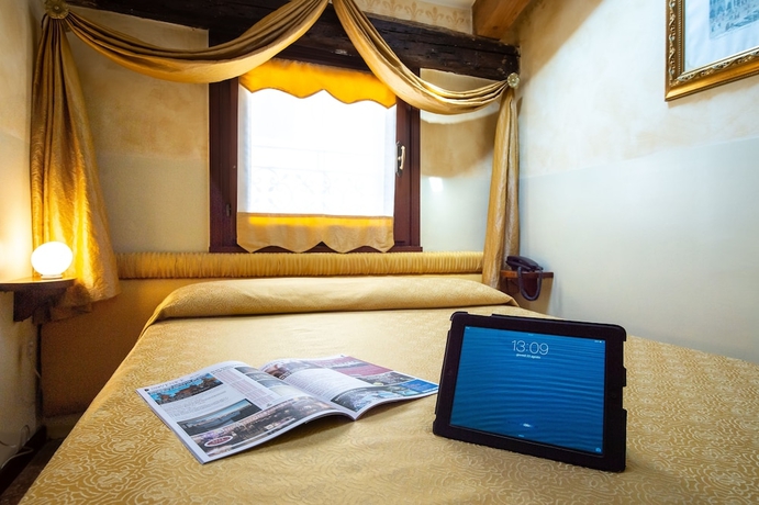 Imagen de la habitación del Hotel Mercurio Venezia. Foto 10