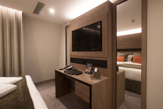 Imagen de la habitación del Hotel Merit Kensington. Foto 12
