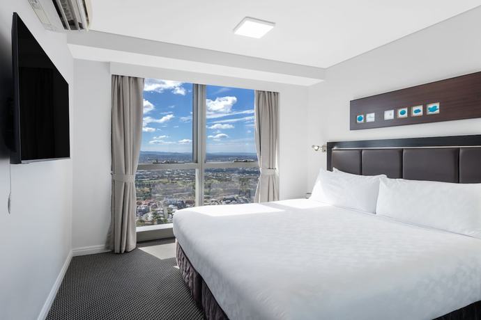 Imagen de la habitación del Hotel Meriton Suites Adelaide Street, Brisbane. Foto 9