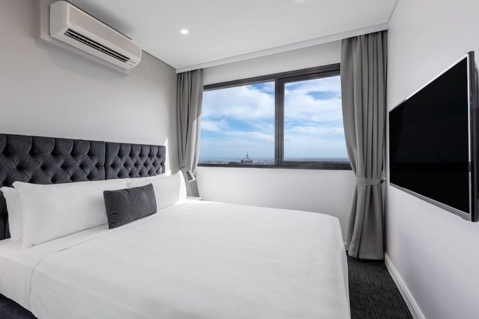 Imagen de la habitación del Hotel Meriton Suites Kent Street, Sydney. Foto 11