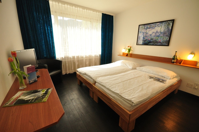 Imagen de la habitación del Hotel Merkur Interlaken. Foto 4