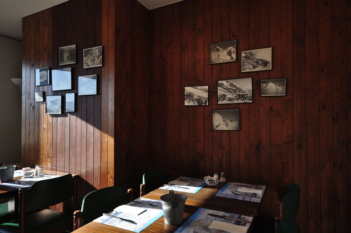 Imagen del bar/restaurante del Hotel Merkur Interlaken. Foto 3