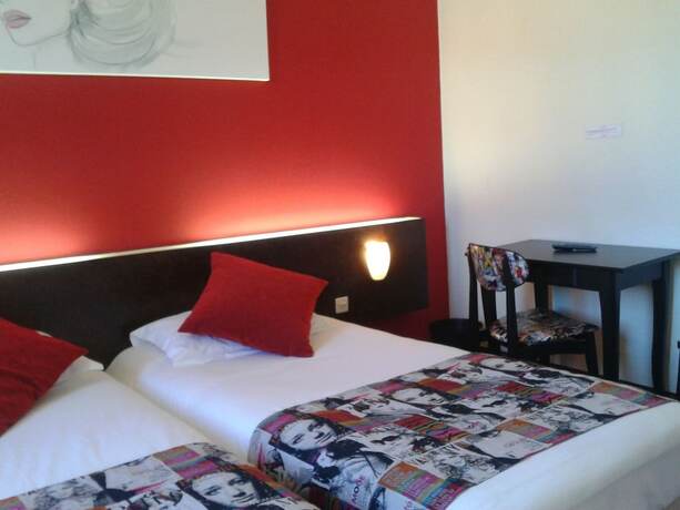 Imagen de la habitación del Hotel Merle Blanc. Foto 13