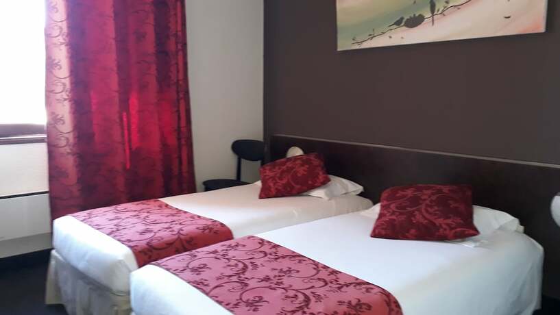 Imagen de la habitación del Hotel Merle Blanc. Foto 15