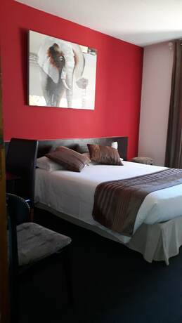 Imagen de la habitación del Hotel Merle Blanc. Foto 16