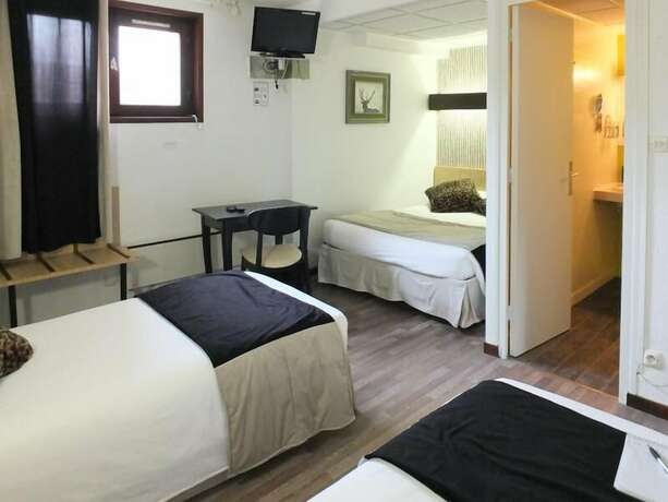 Imagen de la habitación del Hotel Merle Blanc. Foto 18