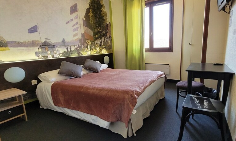 Imagen de la habitación del Hotel Merle Blanc. Foto 20