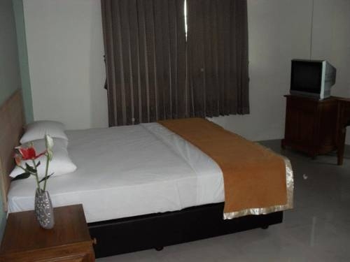 Imagen de la habitación del Hotel Merlin Lodge. Foto 10