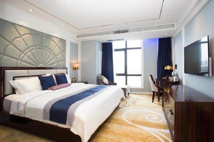 Imagen de la habitación del Hotel Merlinhod Hotel Shanghai Baoshan. Foto 7