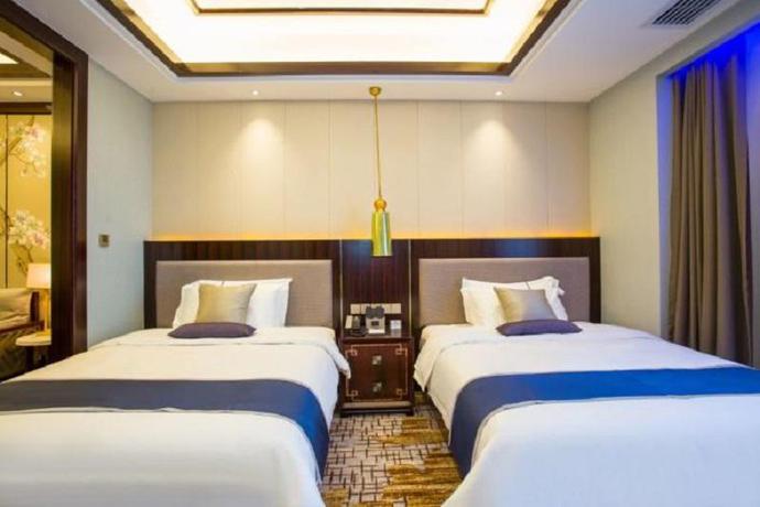 Imagen de la habitación del Hotel Merlinhod Hotel Shanghai Baoshan. Foto 9