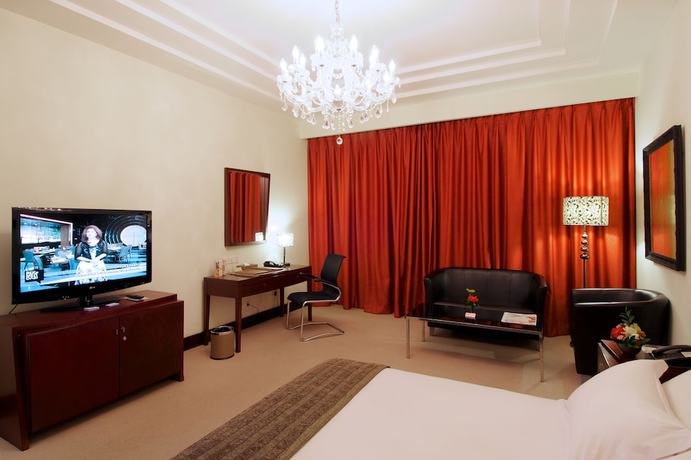 Imagen de la habitación del Hotel Merlynn Park. Foto 7