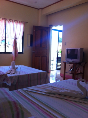 Imagen de la habitación del Hotel Merly's Place Cottages. Foto 3