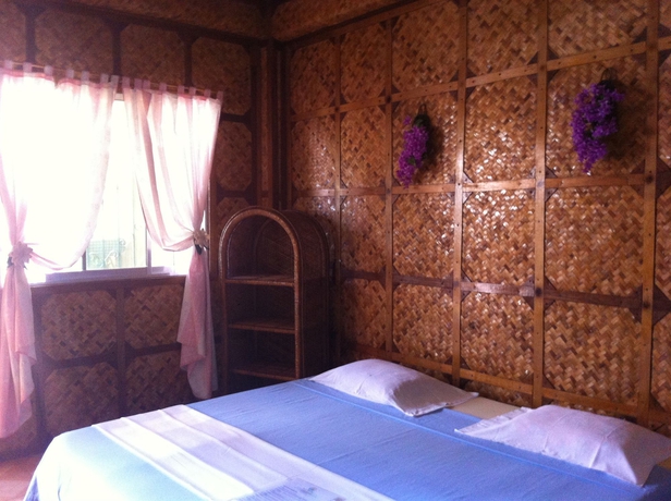 Imagen de la habitación del Hotel Merly's Place Cottages. Foto 7