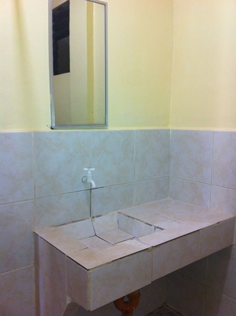 Imagen de la habitación del Hotel Merly's Place Cottages. Foto 14