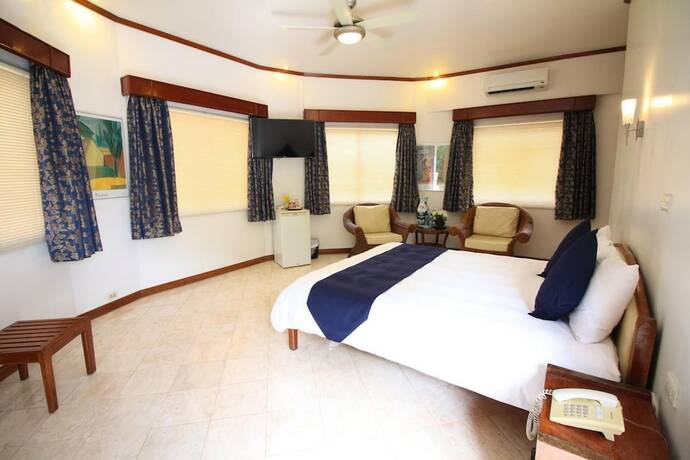 Imagen de la habitación del Hotel Mermaid Resort Puerto Galera. Foto 11