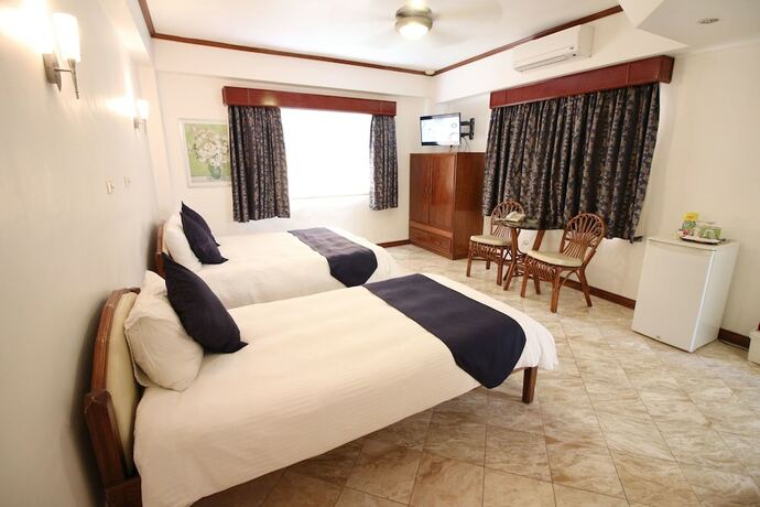 Imagen de la habitación del Hotel Mermaid Resort Puerto Galera. Foto 19