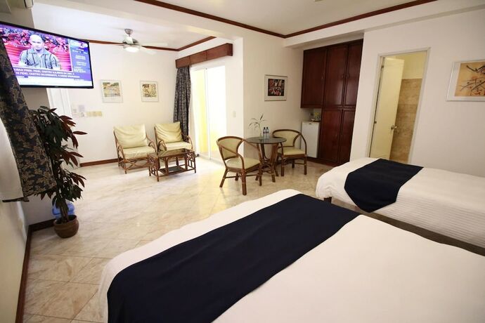 Imagen de la habitación del Hotel Mermaid Resort Puerto Galera. Foto 20