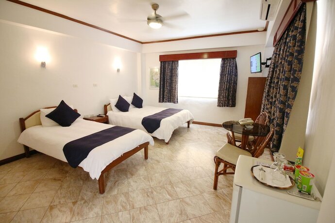 Imagen de la habitación del Hotel Mermaid Resort Puerto Galera. Foto 23
