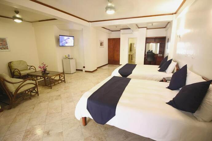 Imagen de la habitación del Hotel Mermaid Resort Puerto Galera. Foto 24