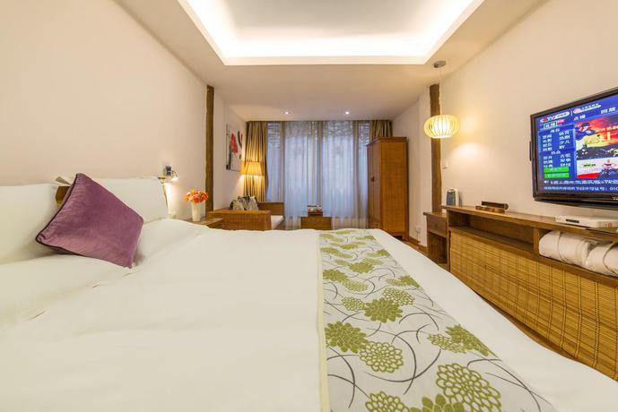 Imagen de la habitación del Hotel Merry Inn Lijiang. Foto 8