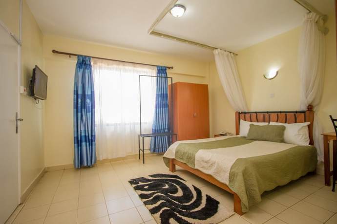 Imagen de la habitación del Hotel Meru Paramount. Foto 16