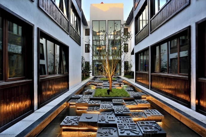 Imagen de la habitación del Hotel Meshee Sezen Suzhou. Foto 14