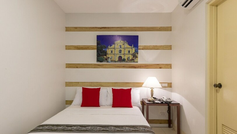 Imagen de la habitación del Hotel Metro Vigan Inn. Foto 13