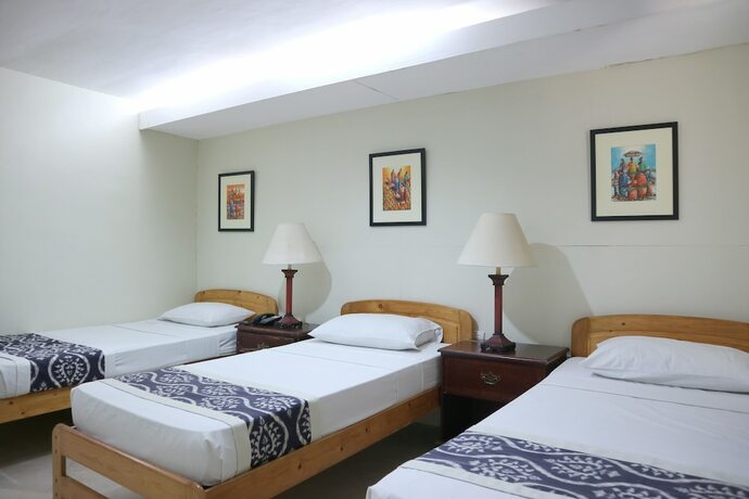 Imagen de la habitación del Hotel Metro Vigan Inn. Foto 18