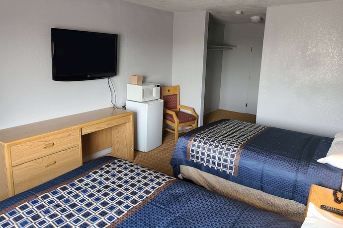 Imagen de la habitación del Hotel MetroParc 'nSuites. Foto 6