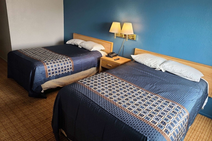 Imagen de la habitación del Hotel MetroParc 'nSuites. Foto 7