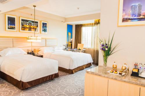 Imagen de la habitación del Hotel Metropark Macau. Foto 9