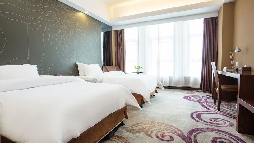 Imagen de la habitación del Hotel Metropolo Changzhou Dinosaur Park Xinbei Wanda Plaza. Foto 17