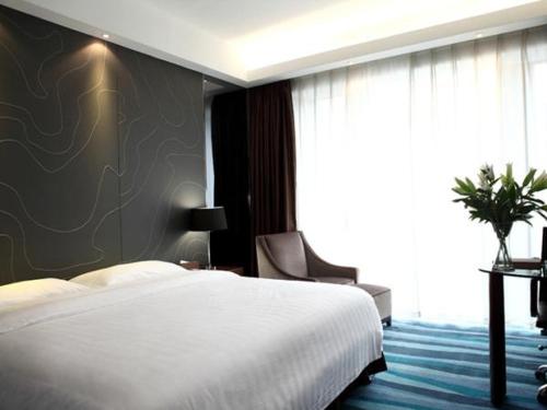 Imagen de la habitación del Hotel Metropolo, Fuzhou, Wanda Plaza-taijiang. Foto 6