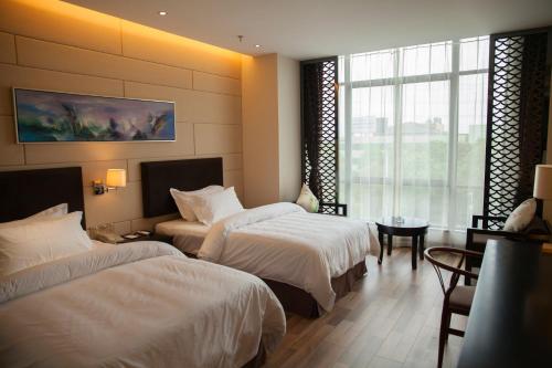 Imagen de la habitación del Hotel Metropolo, Liyang, Tianmu Lake. Foto 7