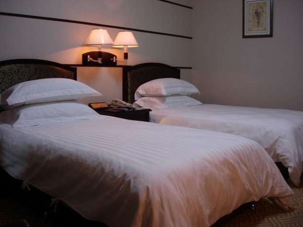 Imagen de la habitación del Hotel Metropolo Qingdao Chengyang Municiple Government. Foto 2