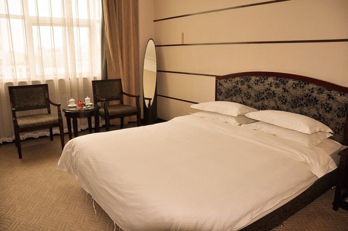 Imagen de la habitación del Hotel Metropolo Qingdao Chengyang Municiple Government. Foto 9