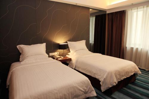 Imagen de la habitación del Hotel Metropolo Shijiazhuang Yuhua. Foto 8
