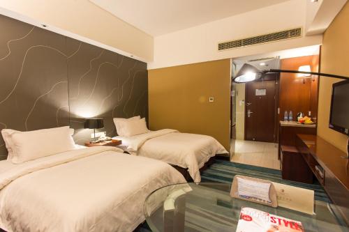Imagen de la habitación del Hotel Metropolo Shijiazhuang Yuhua. Foto 9