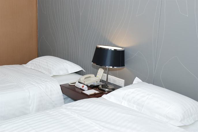 Imagen de la habitación del Hotel Metropolo Wuhan Economic Development Wanda. Foto 8