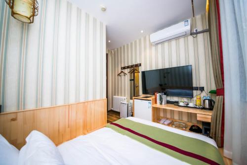 Imagen de la habitación del Hotel Mg - St. Michael's Cathedral, Qingdao. Foto 9