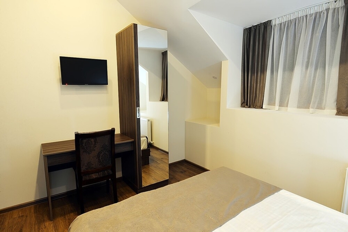 Imagen de la habitación del Hotel Mgk. Foto 7