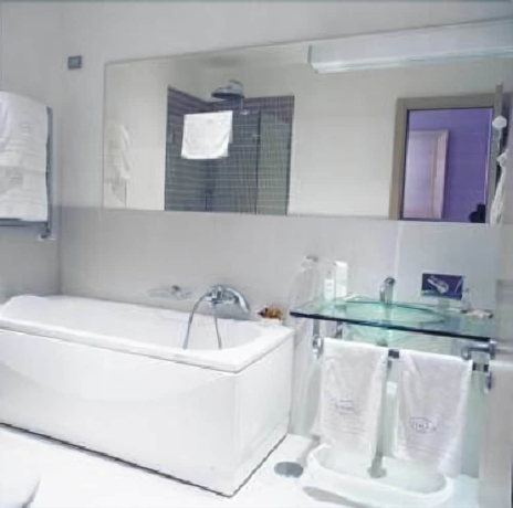 Imagen de la habitación del Hotel Mh Design. Foto 14